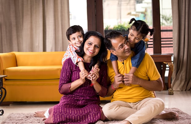 1183297634 Parents having fun with children at home